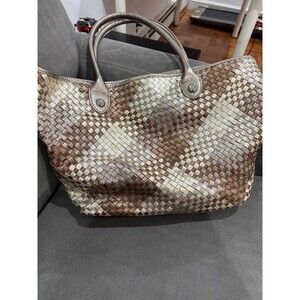 From Elliott Lucca (Saks) in gold metallic woven leather. Double handle tote